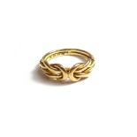 A late Victorian 18ct gold ring, in an interwoven design, London possibly 1895, ring size N,