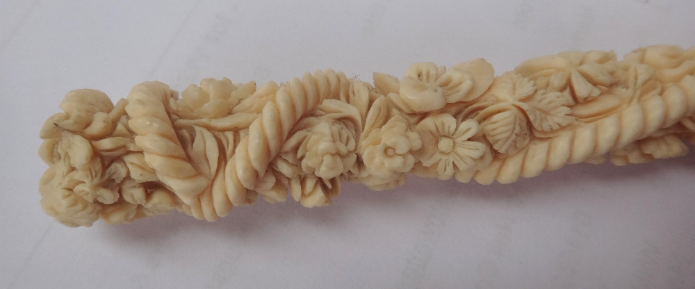 A Japanese ivory parasol handle, early 20th century, with carved foliate decoration and signature, - Image 2 of 12