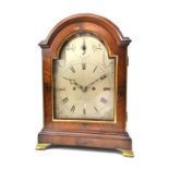 A Victorian mahogany bracket clock with three pad domed case and silvered dial,