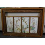Four Chinese porcelain famille-rose rectangular panels, 20th century, mounted in one frame,