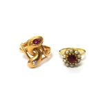 A gold, diamond and ruby set ring, designed as two entwined serpents,