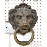 A Victorian patinated bronze door knocker of large proportions, modelled and cast as a lion's head,