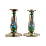 A pair of silver and blue green enamelled Art Nouveau candlesticks,