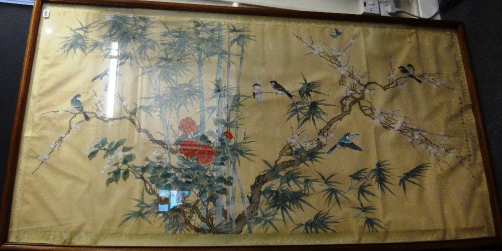 A large Chinese painting on silk, 20th century, painted with birds amongst flowering prunus,