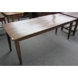 A 19th century French rectangular oak farmhouse table on tapering square supports, 194cm x 75cm.