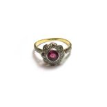 A gold, ruby and diamond set nine stone cluster ring,