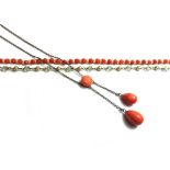 A coral necklace, the front with two graduated coral drops and with a circular coral above,