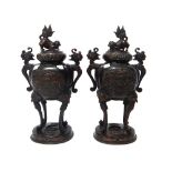 A pair of Japanese bronze two-handled koros and covers, Meiji period,
