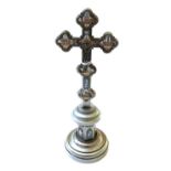 A silvered brass table crucifix, 20th century of Gothic form,