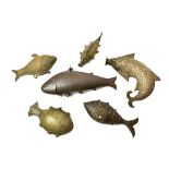 A group of nine Indian brass fish shaped boxes and flasks, 19th century, of various forms, 11cm.