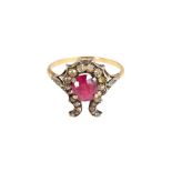 A gold and silver, ruby and diamond set ring,