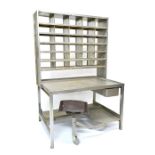 A 20th century sheet iron Post Office sorting desk, the superstructure fitted with pigeon holes,
