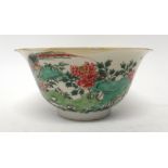 A Chinese famille-verte bowl, Kangxi, painted on the exterior with birds amongst flowering peony,