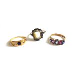 A gold, diamond and synthetic sapphire set three stone ring, a gold,