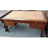 An 18th century style French walnut partners bureau plat with ten frieze drawers and pull out side