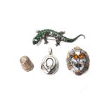 A silver, green and colourless paste set brooch, designed as a lizard,