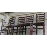 A matched set of seven 18th century ash and oak ladder back dining chairs on turned supports,