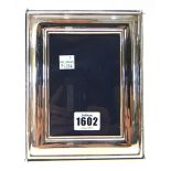 A silver mounted rectangular modern photograph frame.