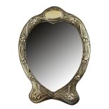 An Art Nouveau silver mounted heart shaped strut backed mirror,