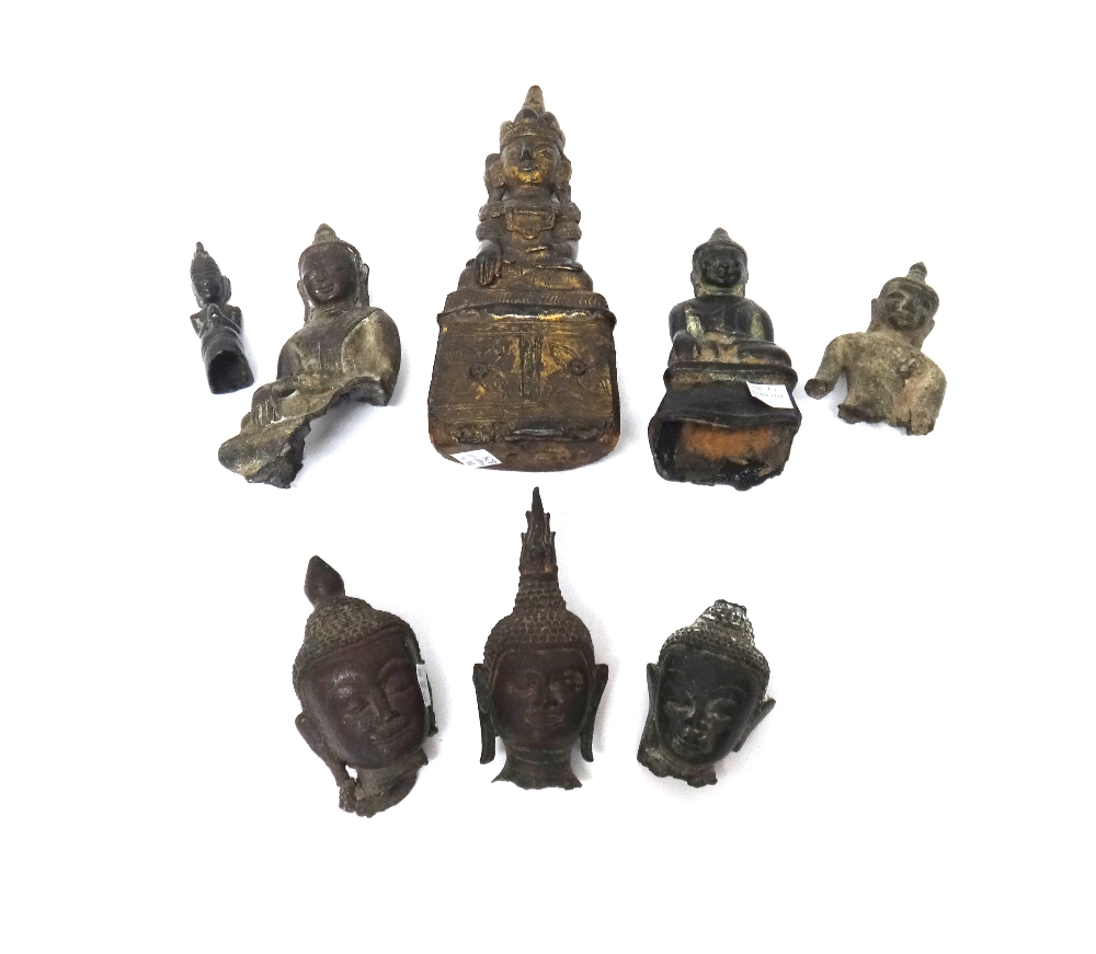 A group of three small Thai bronze buddha heads, probably circa 14th century, tallest 11cm.