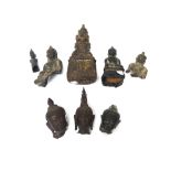 A group of three small Thai bronze buddha heads, probably circa 14th century, tallest 11cm.