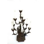 A painted carved wooden ten branch candelabrum table lamp, on a shaped, stepped square base,