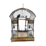 An Edwardian brass wire work bird cage with domed top,