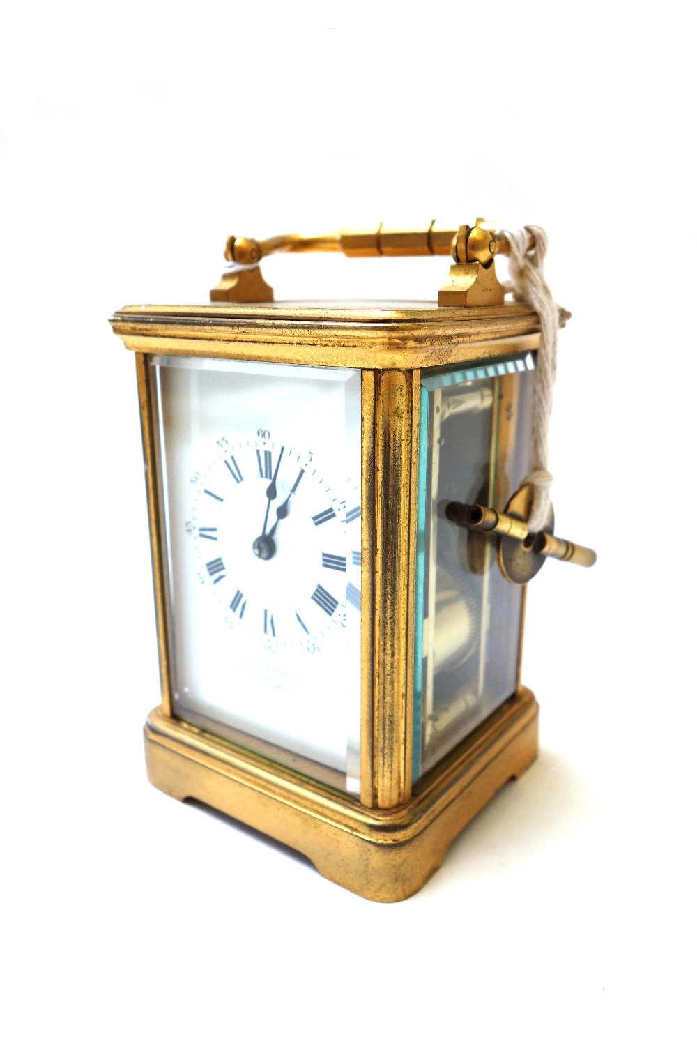 A gilt brass cased carriage clock, early 20th century, the white enamel dial detailed J. W.