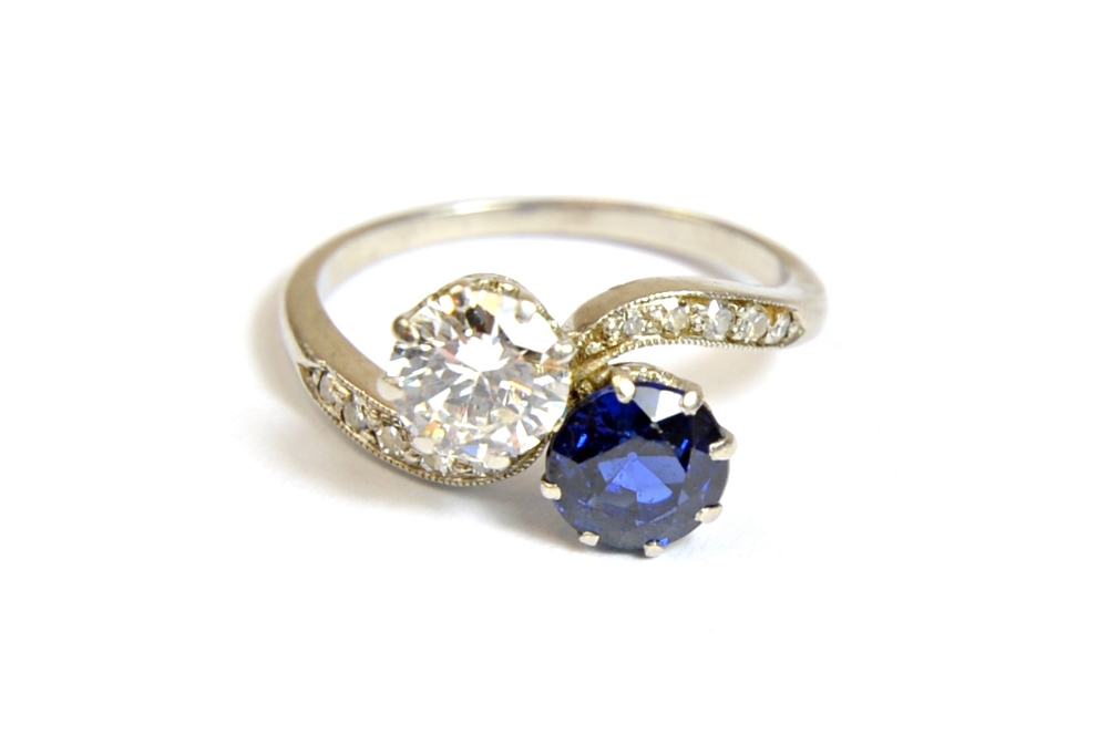 A sapphire and diamond set two stone ring,