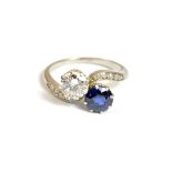 A sapphire and diamond set two stone ring,