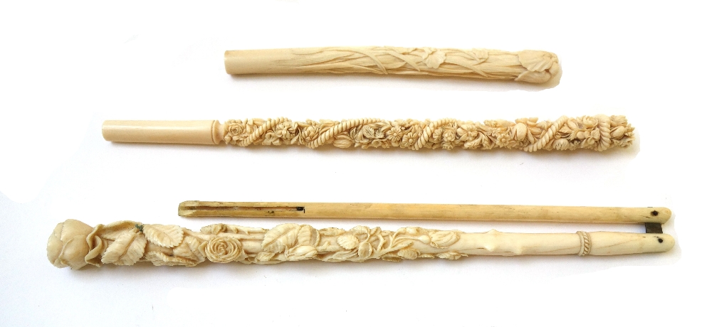 A Japanese ivory parasol handle, early 20th century, with carved foliate decoration and signature,