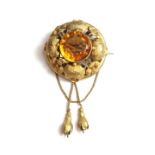 A Victorian gold mounted citrine set single stone brooch,