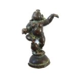 An Indian bronze  figure of bala Krishna, probably 17th century, standing in dancing pose,