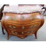 An 18th century style gilt metal mounted kingwood banded mahogany marble topped bombe three drawer