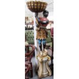 A 20th century painted figure of a blackamoor holding cornucopia on a faux marble stand, 177cm high.