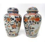 A pair of Japanese Imari vases and covers, Edo period, early 18th century,