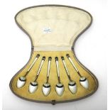 A set of six silver gilt and enamelled coffee spoons,