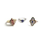 A platinum ring, claw set with an oval cut sapphire at the centre,