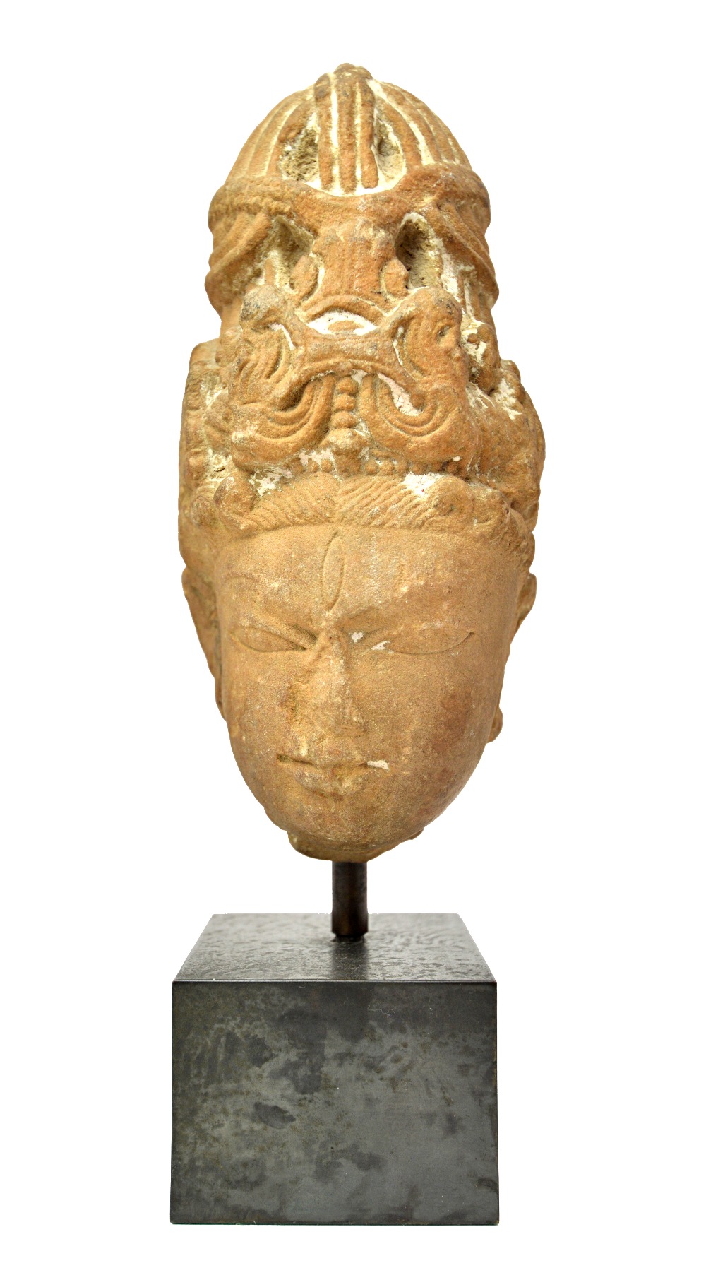 A sandstone head of a deity, Central India, circa 11th/12th century,wearing a tall headdress, (a.