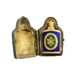 A gold and enamelled miniature perfume bottle, of tapered oval form,