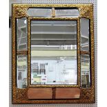A 18th century style Flemish gilt metal mounted cushion wall mirror with segmented frame 101cm wide