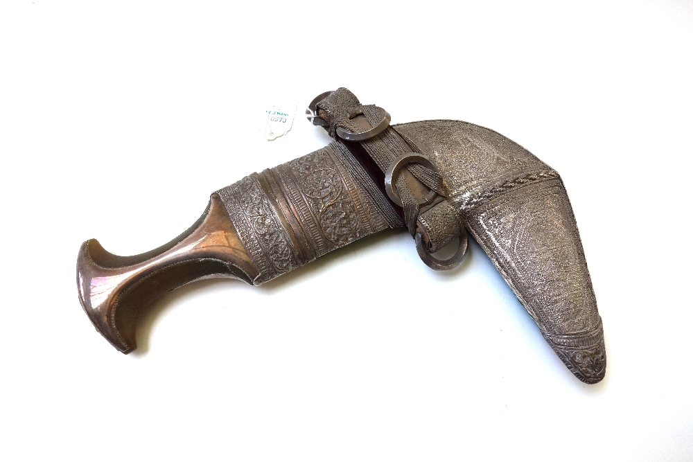 A presentation Middle Eastern Jambiya, with a shaped horn handle,