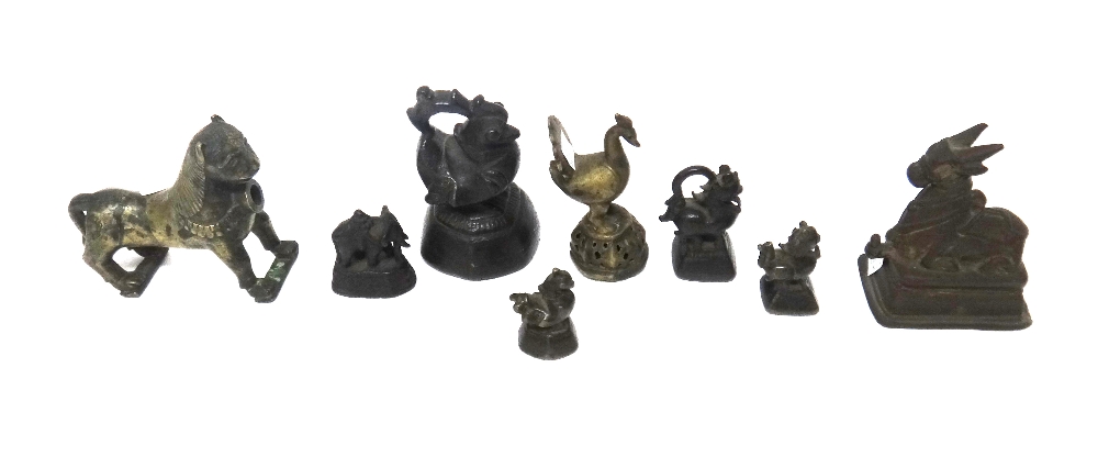 A group of four Burmese bronze duck and animal opium weights, 19th century, largest 12cm.