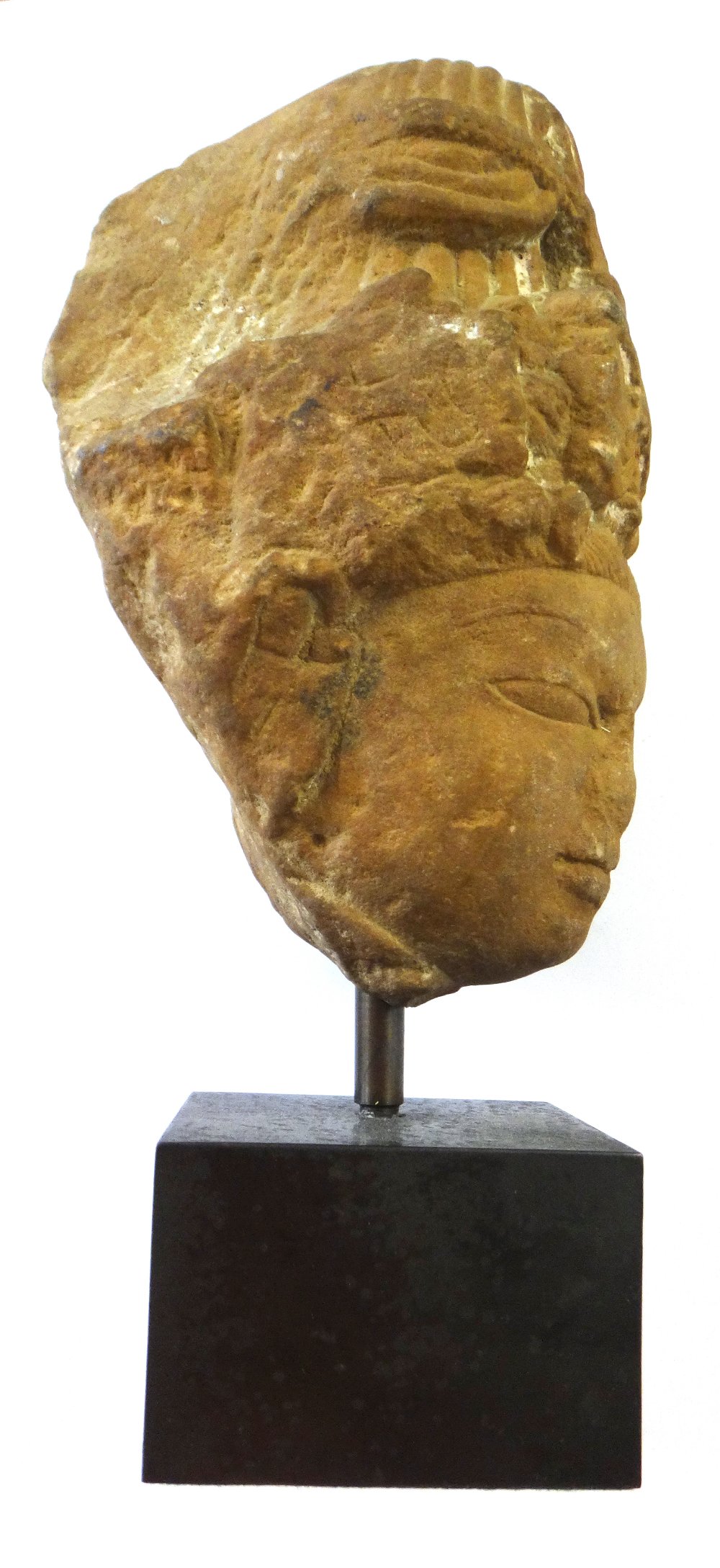 A sandstone head of a deity, Central India, circa 11th/12th century,wearing a tall headdress, (a. - Image 4 of 5