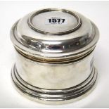 A silver box, of cylindrical form, with a pull-off lid on a circular base, Birmingham 1985,