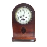 An Edwardian mahogany and satinwood strung mantel clock,