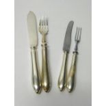 A set of six pairs of silver fish knives and forks, Sheffield 1950, gross weight 765 gms,