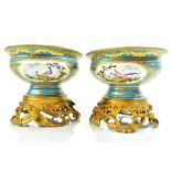 A pair of Sevres style turquoise ground gilt bronze mounted bowls, the porcelain mid-19th century,