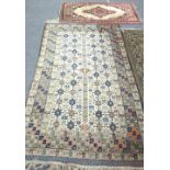 An Erivan rug, Caucasian, the ivory field with allover geometric motifs and a cross border,