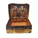 A lady's silver mounted travelling dressing set, fitted with five toilet bottles and jars,